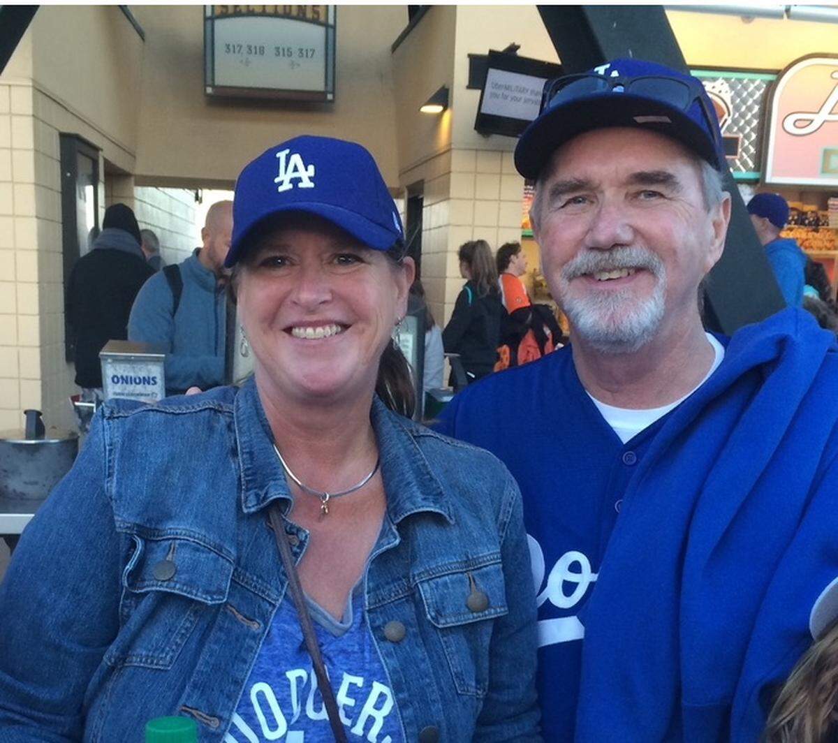 Rhoda Chute and her late-husband, Bob Chute, pose in Los Angeles Dodgers gear.