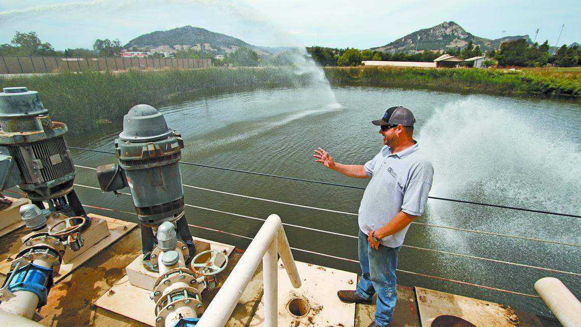Justin McBride, water resources facility manager, talks about some of the components at the Irrigation Training and Research Center's facility which has a reservoir that covers 2 acres, several different pump designs, two canals and several other features all built over the years by students.