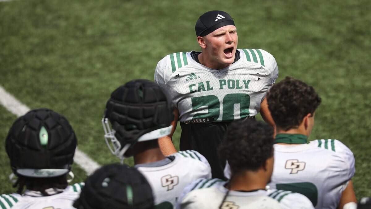 Kenny Olson shouts to defense at Cal Poly football scrimmage at Musting Memorial Field on Aug. 22, 2025.