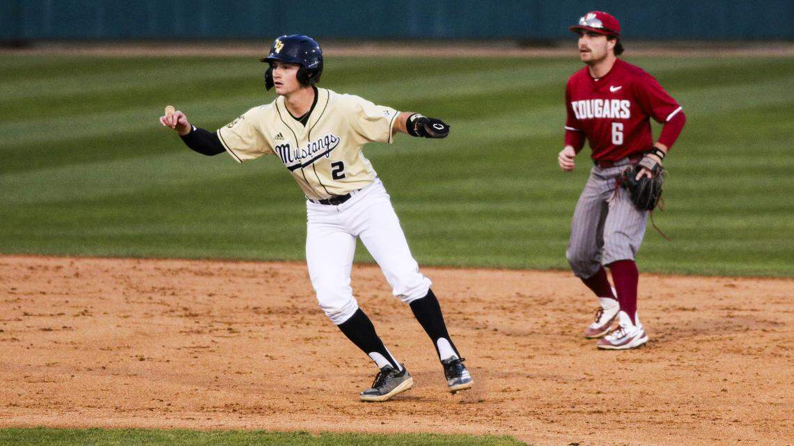 Jake Downing takes a lead off of second base as Gavin Roy returns to fielding position. Washington State beat Cal Poly baseball 5-4 on Feb. 23, 2026.