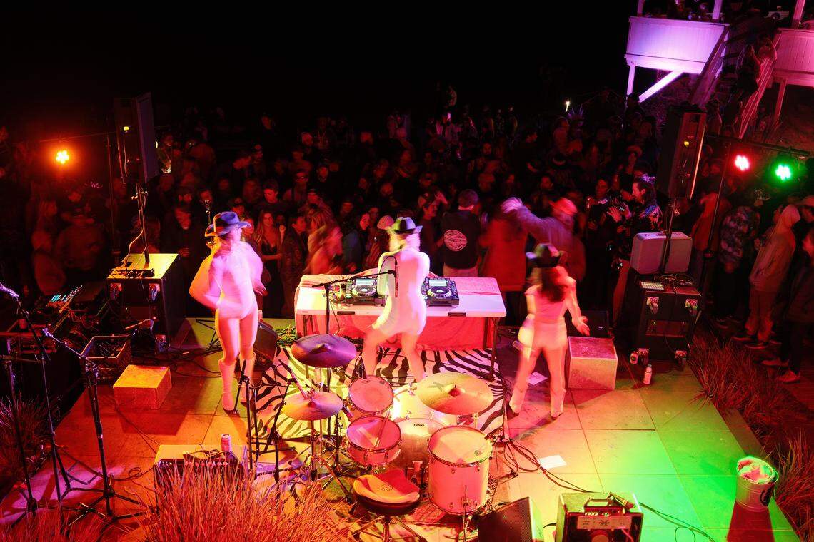Competitors and viewers celebrate at a Cayucos beach house after the third annual Diva Cup Surf Invitational, San Luis Obispo County’s only woman’s surf competition, on Nov. 22, 2025.