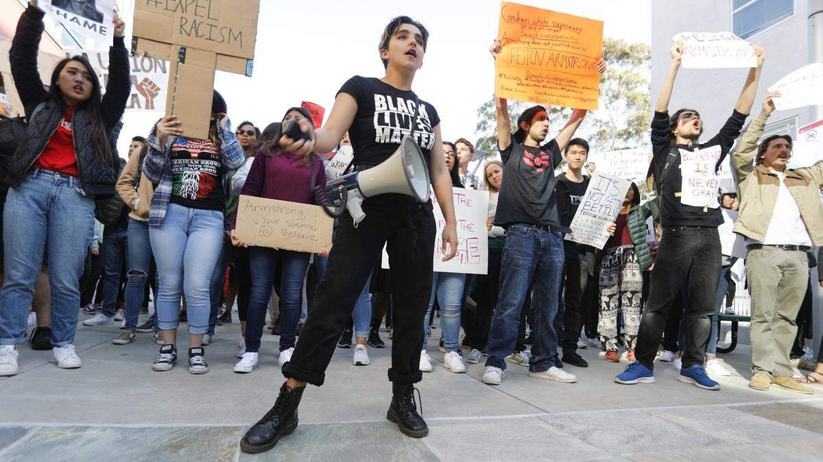 Students protest at Cal Poly Open House in response to fraternity photos that showed one student in blackface and others imitating gang members.