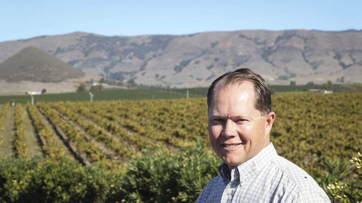 Jim McGarry, owner-vineyard manager with Pacific Coast Farming shows visitors around Edna Valley area farming operations on Oct. 29, 2025.