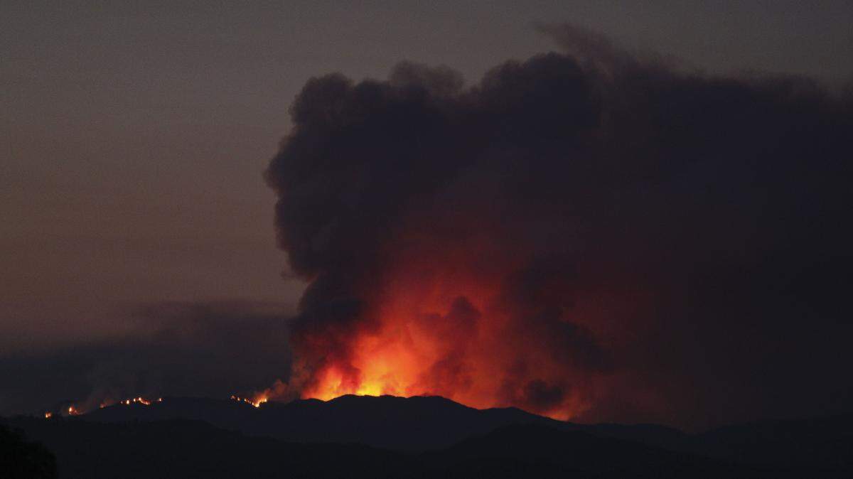 The Gifford Fire burns in the Garcia Wilderness south of Pozo in the Los Padres National Forest before dawn on Aug. 12, 2025.