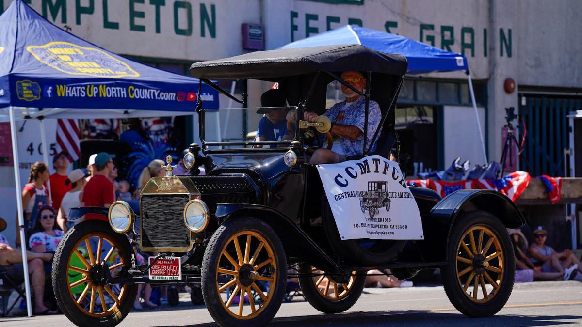 A Ford Model T driven by a member of the Central Coast Model T Ford Club of America cruises down the street in the Templeton Fourth of July Parade Thursday, July 4, 2024. The parade featured dozens of floats and acts, including classic cars, marching bands and appearances by local law enforcement and fire services.