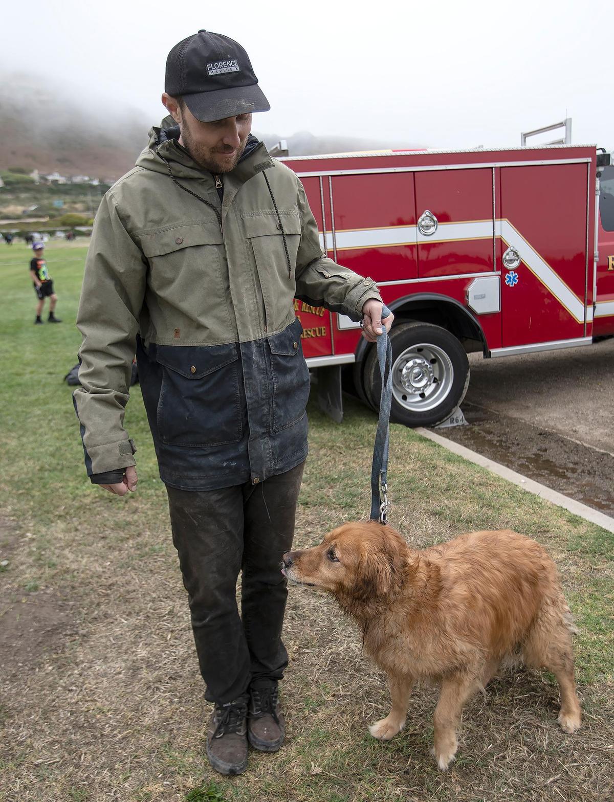 Rosie, a golden retriever, chased an animal off the side of a cliff near Dinosaur Caves on Thursday morning, June 29, 2023. Her owner Ryan McCormick scaled the cliff to find her, and the pair were rescued by SLO County firefighters.