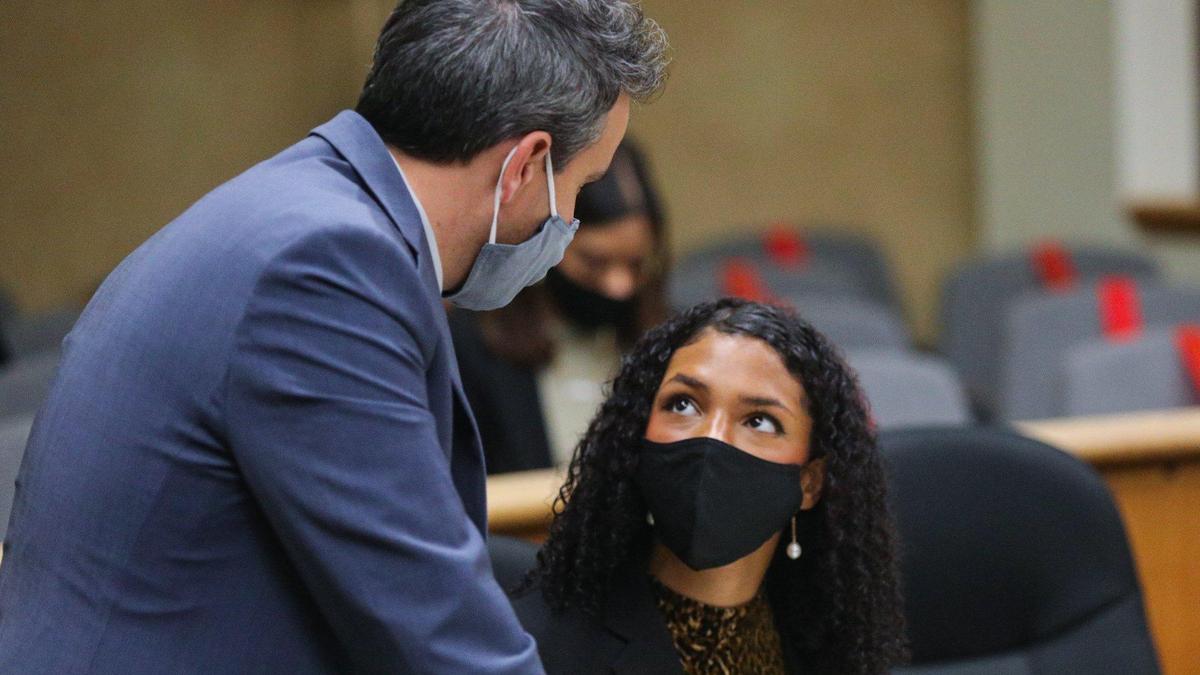 Black Lives Matter activist Tianna Arata, right, appears in San Luis Obispo Superior Court with one of her attorneys, Patrick Fisher, on Thursday, Dec. 10, 2020.