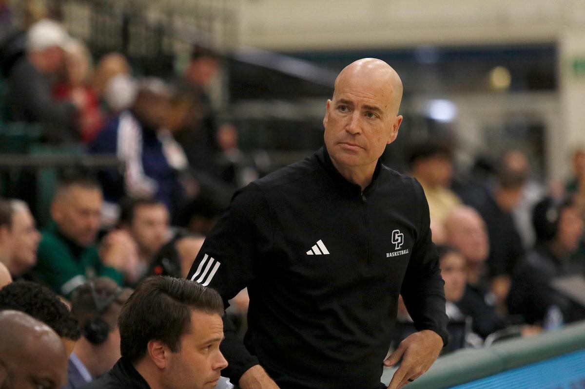 Cal Poly Head Coach Mike DeGeorge watches the team from the sideline. Cal Poly beat Seattle University 75-71 in a college basketball game at Mott Athletics Center on Nov. 14, 2024.