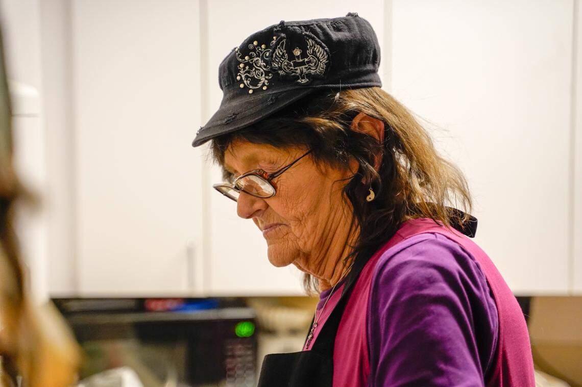 Darlene Maphis, 66, prepares a meal in her apartment at the Templeton Place II affordable housing community on Thursday, Sept. 19, 2024. Maphis said even with affordable housing and some of her expenses covered, she still struggles with San Luis Obispo County’s high cost of living.