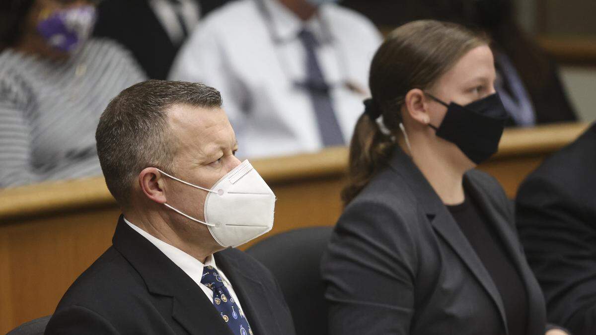 Paul Flores, left, listens in San Luis Obispo Superior Court on Wednesday, Sept. 22, 2021. Flores, who is accused of the murder of Cal Poly student Kristin Smart, is seated next to Sara Sanger, one of his defense attorneys. Superior Court Judge Craig van Rooyen moved to proceed the case against Flores and his father, Ruben Flores, toward trial with arraignment scheduled for Oct. 20.