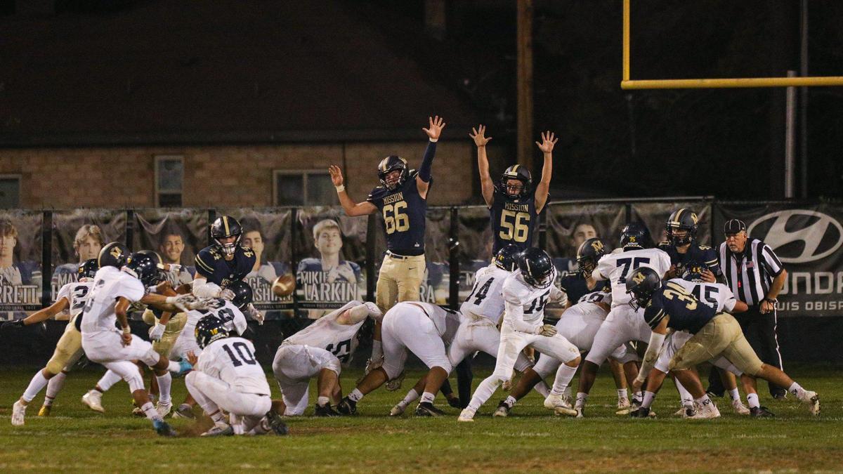 The point after by Arroyo Grande is good despite a leaping defense from Mission. Mission Prep beat Arroyo Grande 41-35 in a Mountain League football game on Oct. 14, 2022.