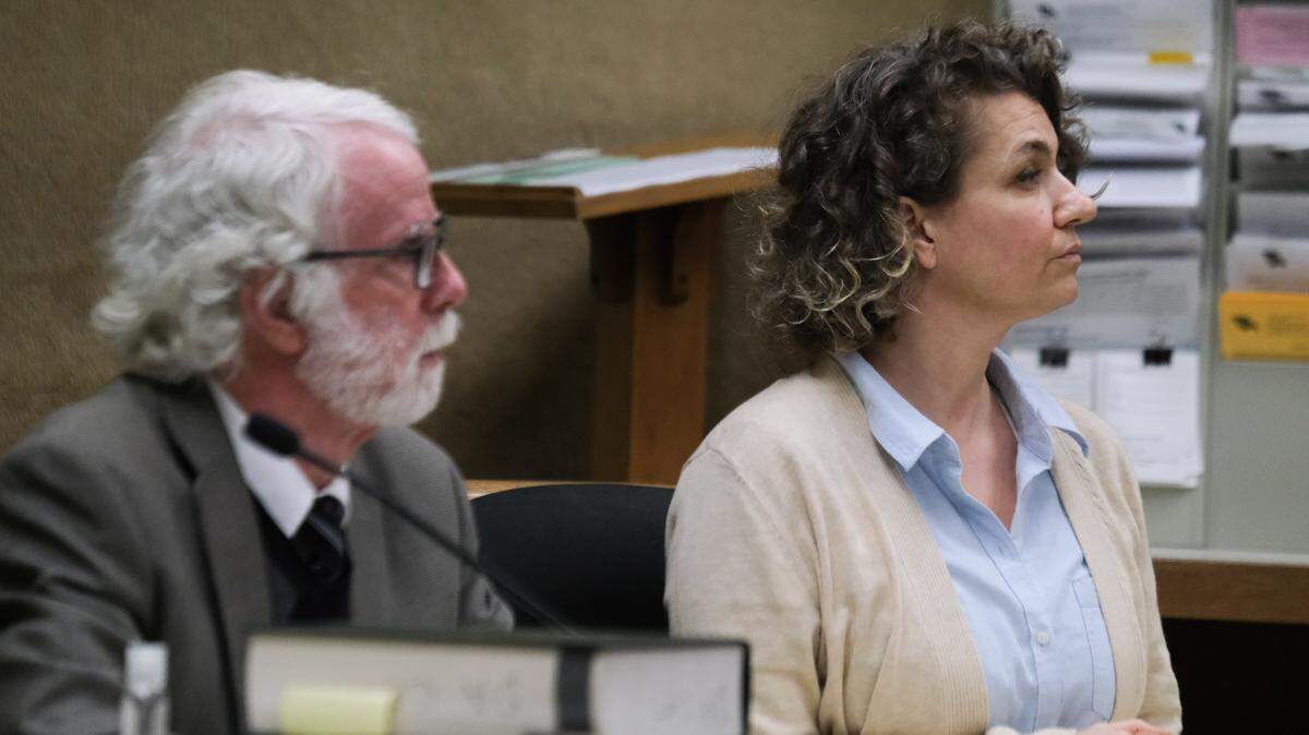 Brandi Turner, right, and her attorney Jeffry Radding listen during the verdict reading in the murder trial against her on Jan. 24, 2022. A jury could not agree on whether she murdered Quinn Hall when she sold him the fentanyl that killed him, and the judge declared a mistrial.