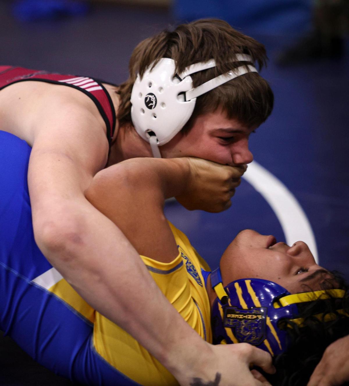 Brock Williams of Paso Robles works toward a first-round pin of Marcos Gonzales of Parlor. Over 900 wrestlers from across California came to Morro Bay to attend the California Invitational Tournament on Jan. 19, 2024.
