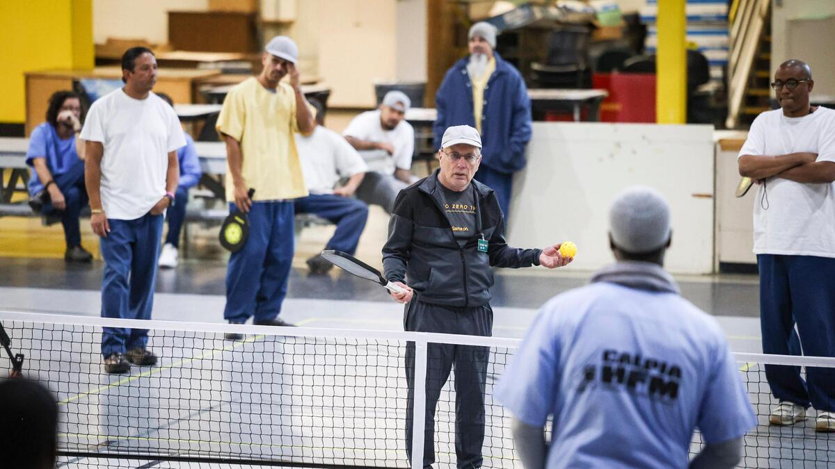 Pickleball coach Roger BelAir visited the California Men’s Colony in San Luis Obispo on Nov. 12, 2024, to teach the game to inmates. Hollywood filmmaker Daniel Ostroff was producing the documentary “Pickleball in Prison,” and a film crew was recording how the sport can break down barriers and provide positive interactions between inmates and staff.