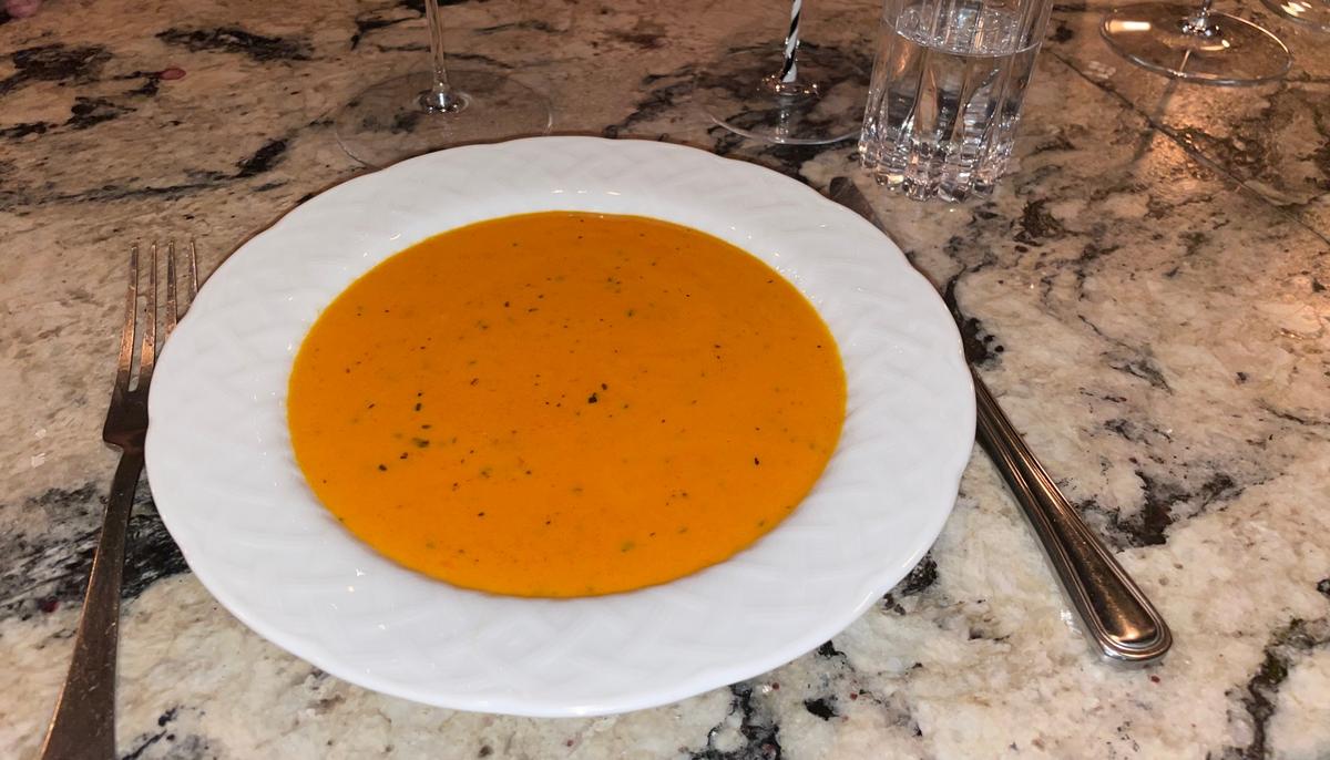 Chef and sommelier Ian Adamo roasted, smoked and juiced tomatoes for a dairy-free tomato soup served at his restaurant on Dec. 10, 2024.