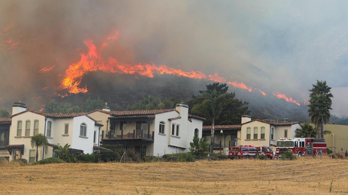 Houses above the street named Costa Rica were threatened by a wind driven brush fire quickly moved south along Highway 101 along into Pismo Beach June 15, 2020.