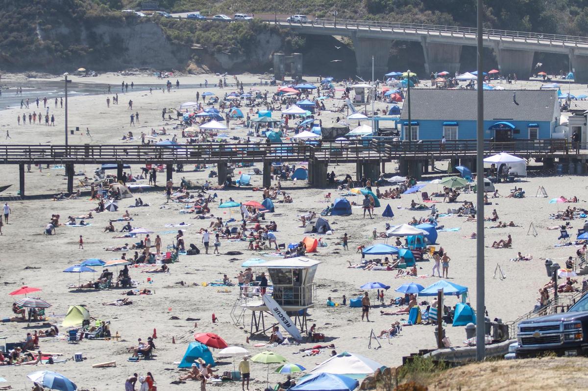 Crowds enjoy the sunshine at Avila Beach on Saturday, July 4, 2020.