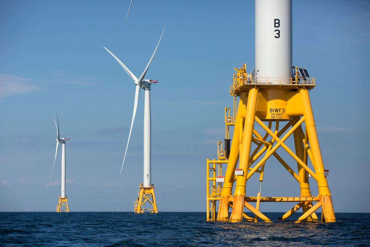 In this Aug. 15, 2016 file photo, three of Deepwater Wind’s five turbines stand in the water off Block Island, R.I, the nation’s first offshore wind farm.