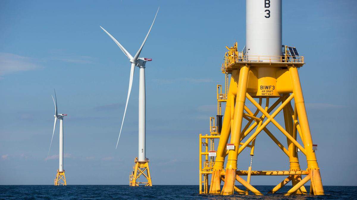 In this Aug. 15, 2016 file photo, three of Deepwater Wind’s five turbines stand in the water off Block Island, R.I, the nation’s first offshore wind farm. Plans call for building similar turbines off the coast of California.