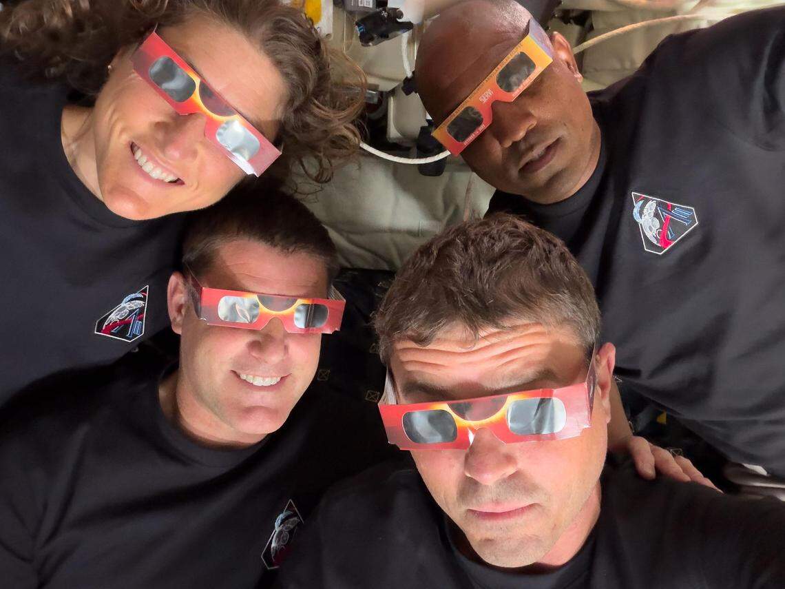 The Artemis II crew — Mission Specialist Christina Koch (top left), Mission Specialist Jeremy Hansen (bottom left), Commander Reid Wiseman (bottom right), and Pilot Victor Glover (top right) — uses eclipse viewers, identical to what NASA produced for the 2023 annular eclipse and 2024 total solar eclipse, to protect their eyes at key moments during the solar eclipse they experienced during their lunar flyby on April 6, 2026.