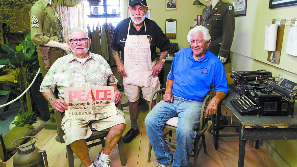 Larry Moore, left, Joe Martinez and Don Avery had jobs as newsies selling newspapers at Camp Roberts in the 1940s and ’50s when they were kids. Here, they’re at the the Camp Roberts Historical Museum Annex.