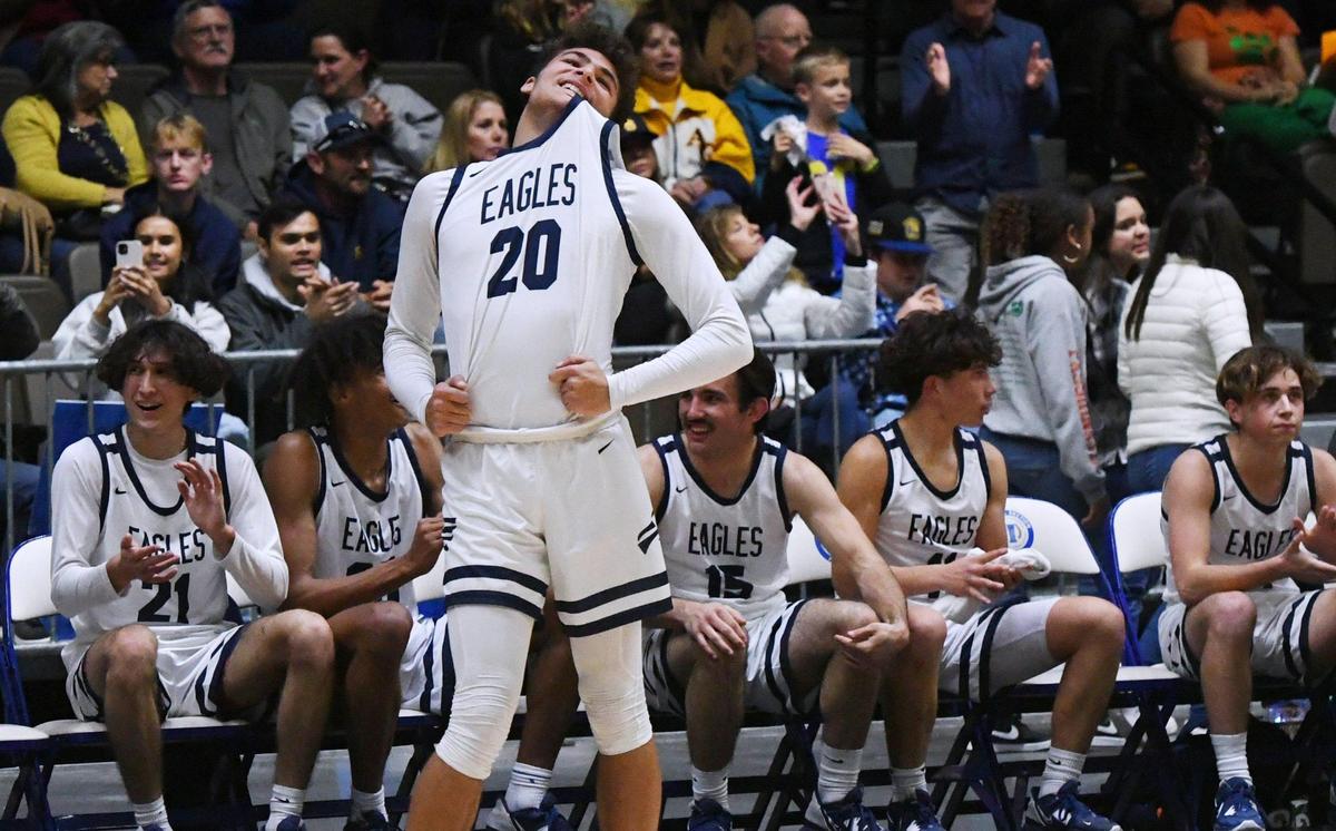 Arroyo Grande’s Damian Santos chews on his jersey as the game against Portervillle winds down at the CIF Central Section basketball championships Friday, Feb. 24, 2023, in Fresno. Arroyo Grande won 59-30.