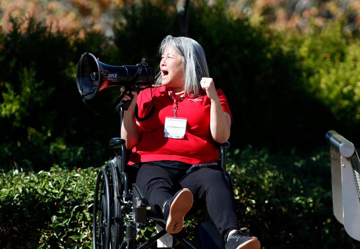 Lisa Kawamura, a 26-year Cal Poly lecturer with the communications studies department and chapter president the California Faculty Association San Luis Obispo (CFA SLO), was among several union members who picketed outside a Cal Poly alumni event at the Performing Arts Center on Friday, Oct. 27, 2023, in support of higher state university salaries.