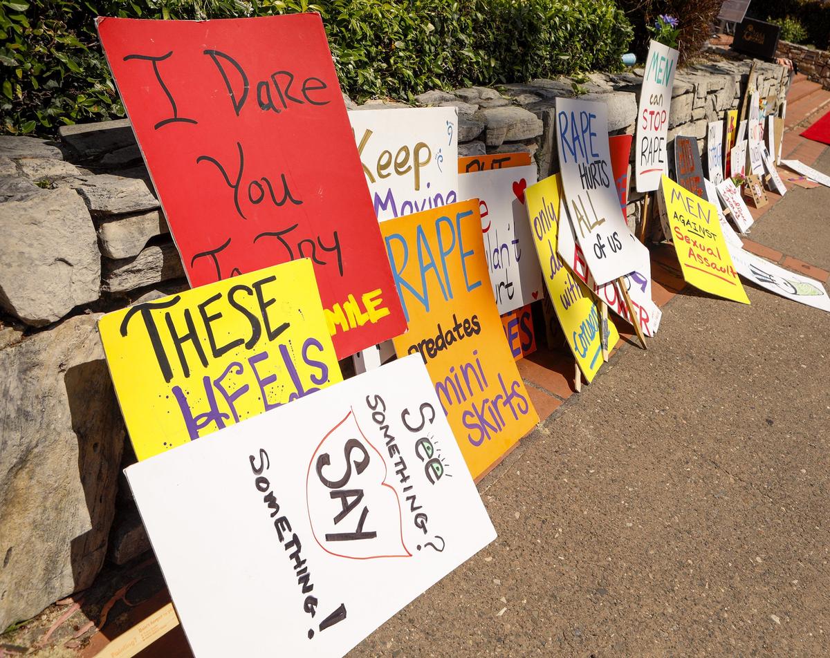 Signs against sexual assault are lined up and ready for the start of San Luis Obispo’s 2018 Walk a Mile in Her Shoes event downtown.