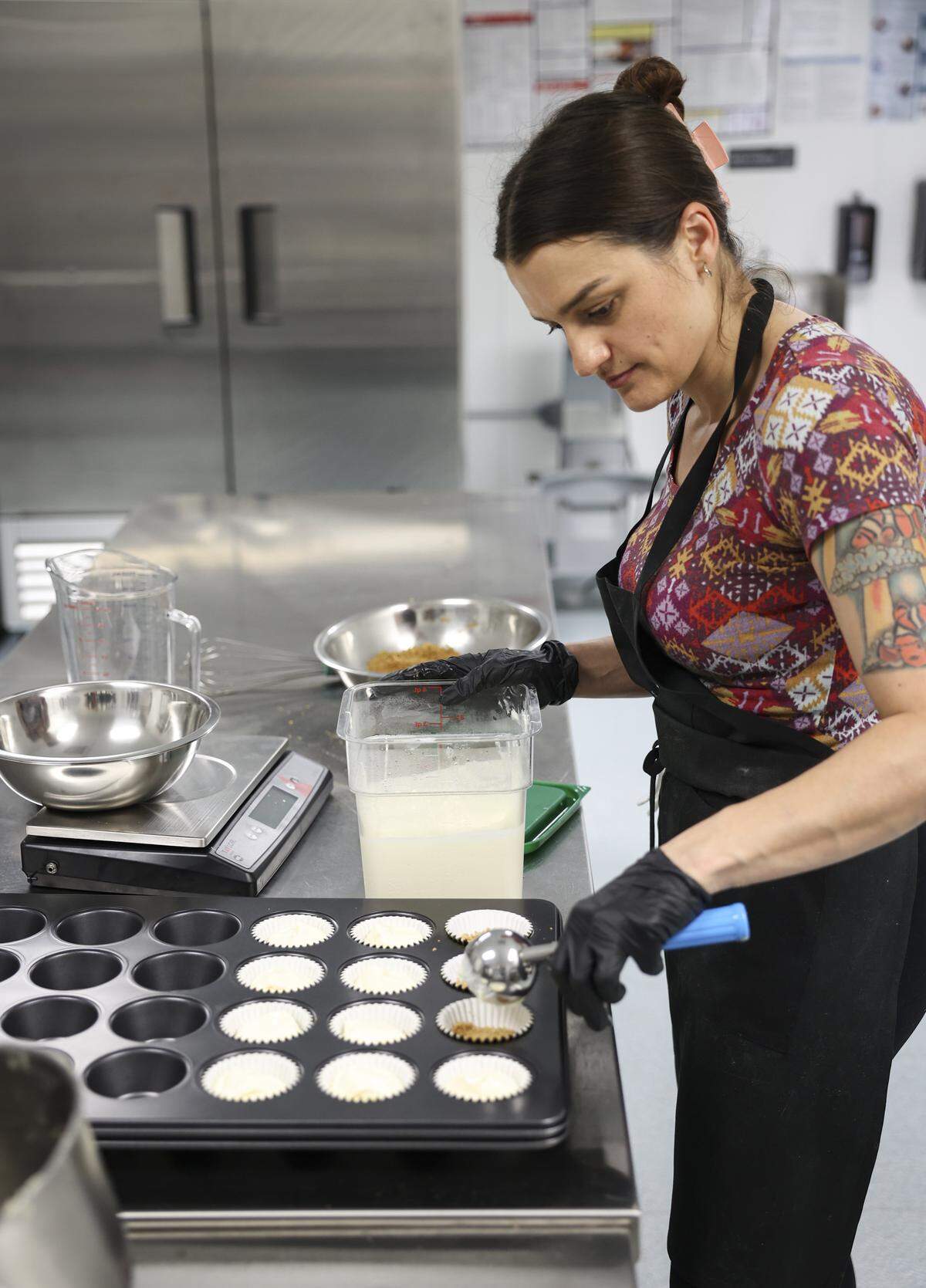 Mercedes White makes mini blueberry cheesecake graham cracker muffins. She is owner of Wendy White's Bakery in downtown Atascadero, seen here on March 13, 2026.
