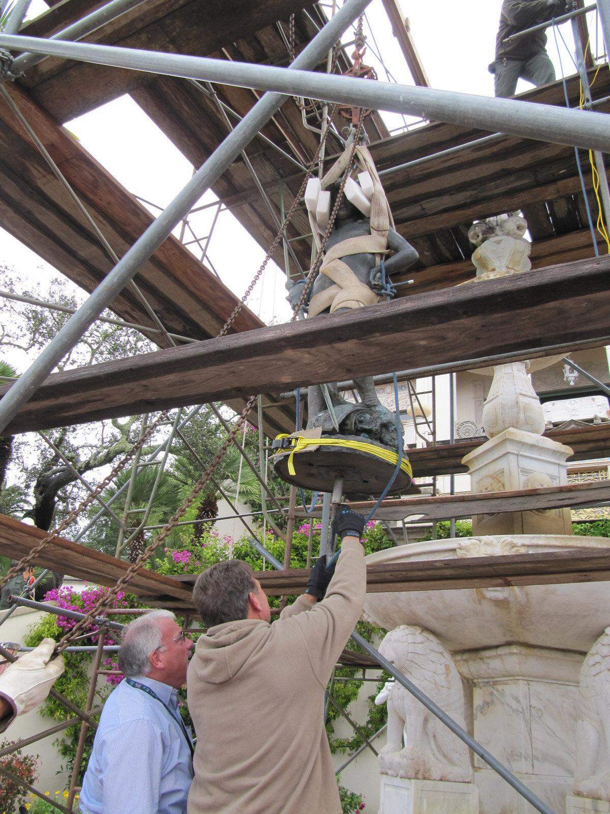 In a 2012 photo, Hoyt Fields, Hearst Castle museum director, left, and Castle worker Gerry Crofts check the rod that connects the bronze statue of David to a tall marble fountain outside Casa Del Sol, one of the guest houses on the former estate of media mogul William Randolph Hearst.