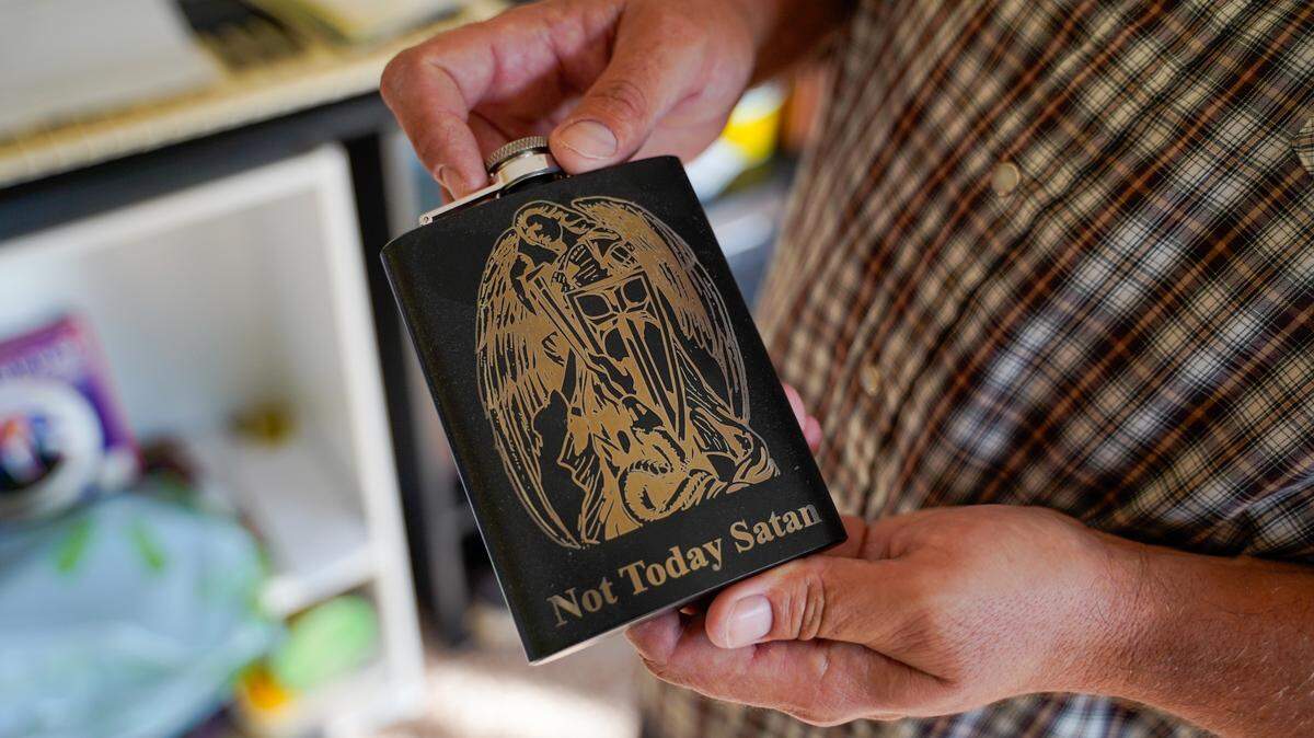 Luke, an Arroyo Grande resident who recently moved into a permanent home using a housing choice voucher, shows a flask made by a friend who saved his life during a relapse into alcohol abuse.