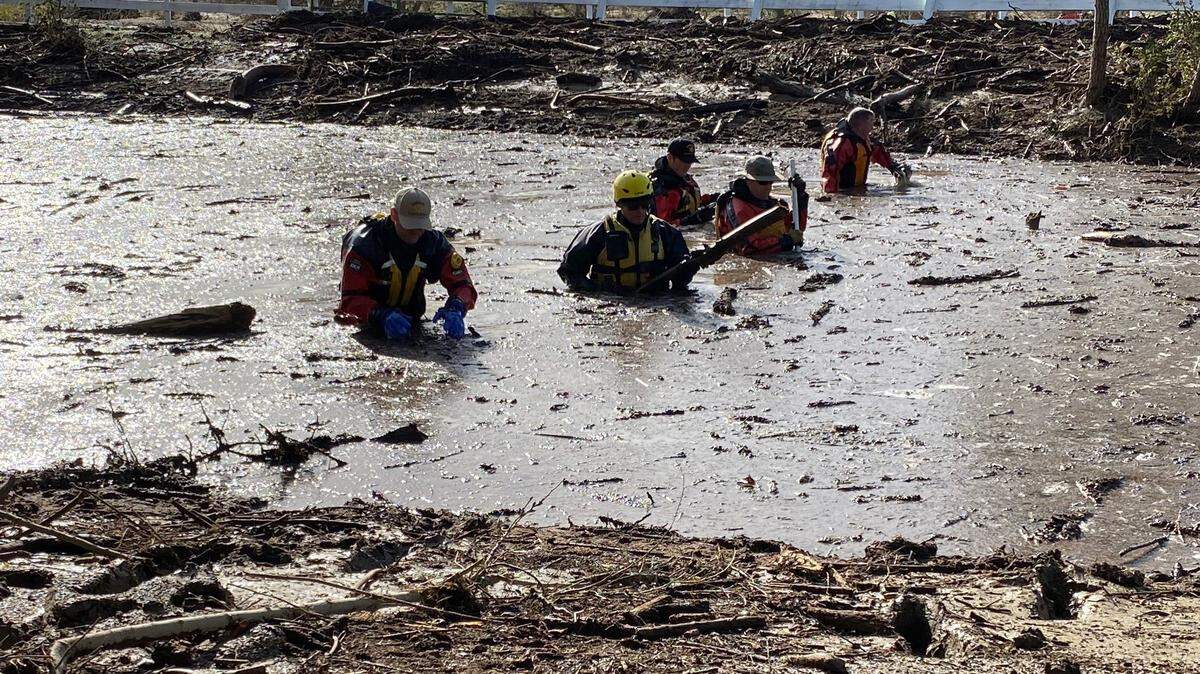 Search teams look for 5-year-old Kyle Doan, who went missing Jan. 9, 2023, near San Miguel when he was carried away by floodwaters. Doan has not been found after three days of searching.