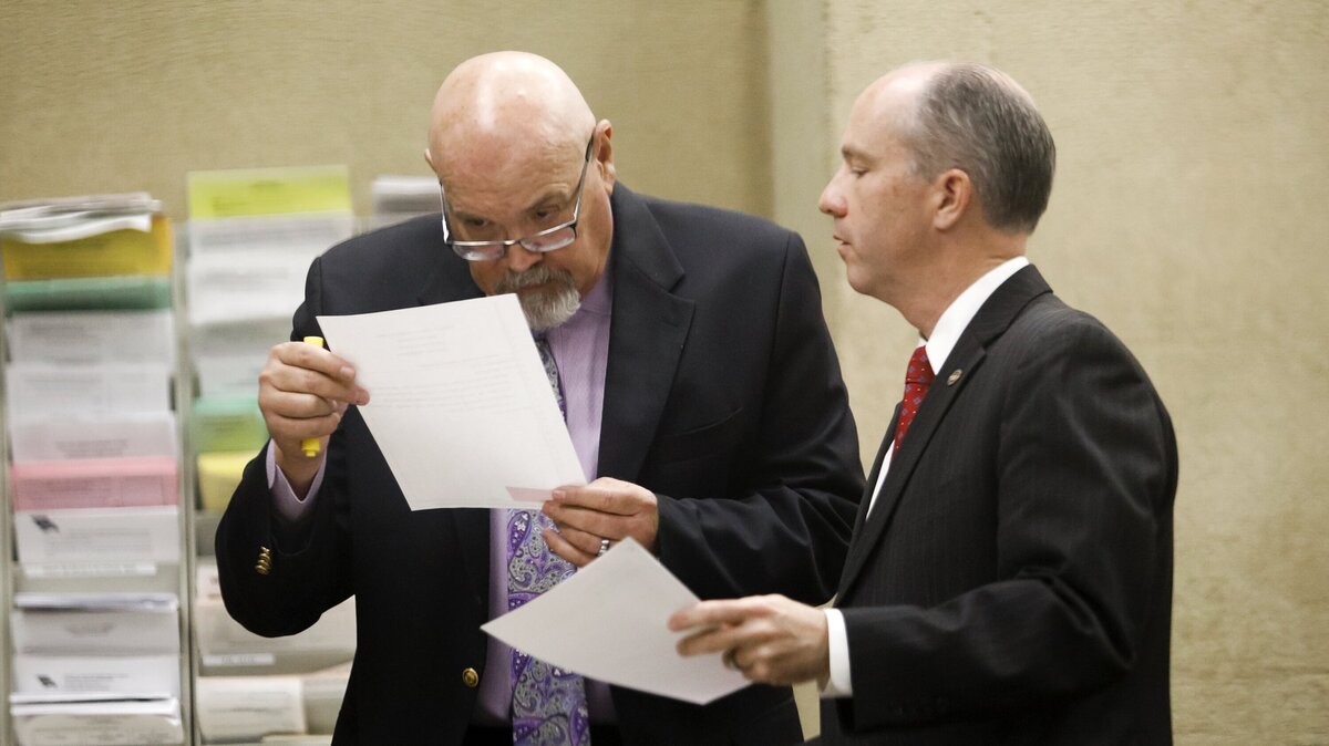 San Luis Obispo County District Attorney Dan Dow, right, confers with defense attorney Ilan Funke-Bilu before the start of the preliminary hearing for Herbert George Connor, 72, of Cambria, on June 26.