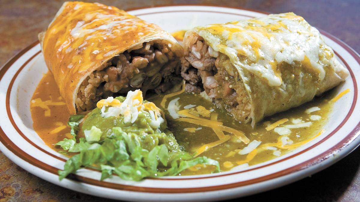 Hefty burritos are a specialty at Chino’s, like this asada version with red and green sauce.