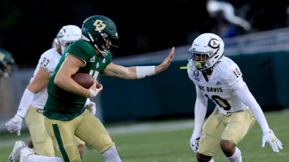 Cal Poly quarterback Spencer Brasch runs with the ball in the Mustangs’ 24-13 loss to UC Davis at Alex G. Spanos Stadium on Saturday, Oct. 23, 2021.