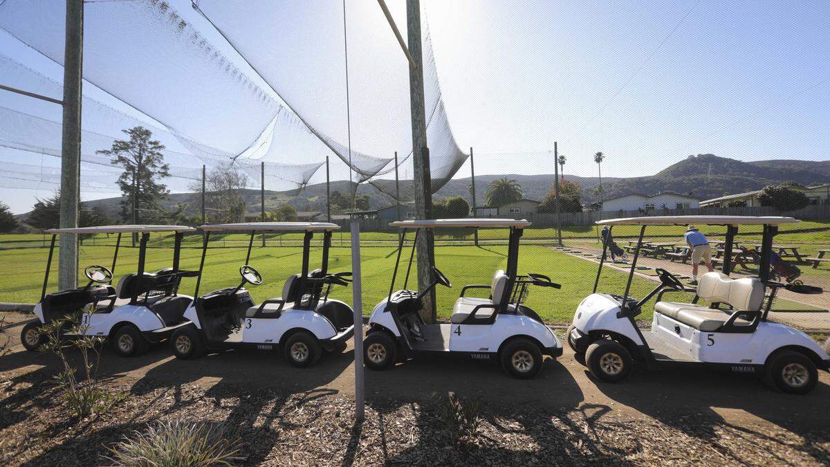 Gollf carts are lined up by a netted driving range. Laguna Lake Municipal Golf Course is a ten hole executive length golf course Managed by the City of San Luis Obispo seen here on Feb. 2, 2026.