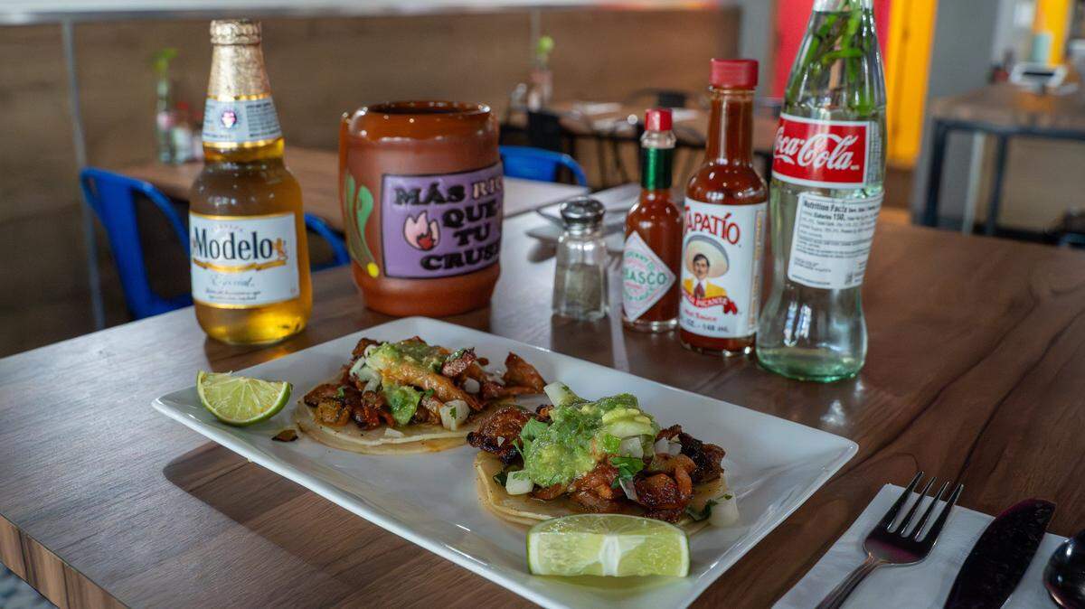 Al pastor tacos, served with a Modelo and a special mug at Al Chile! in Paso Robles on Thursday, March 19, 2026. The family-owned Mexican restaurant opened in November with a soft opening, serving family recipes like birria, menudo, enchiladas and tacos.