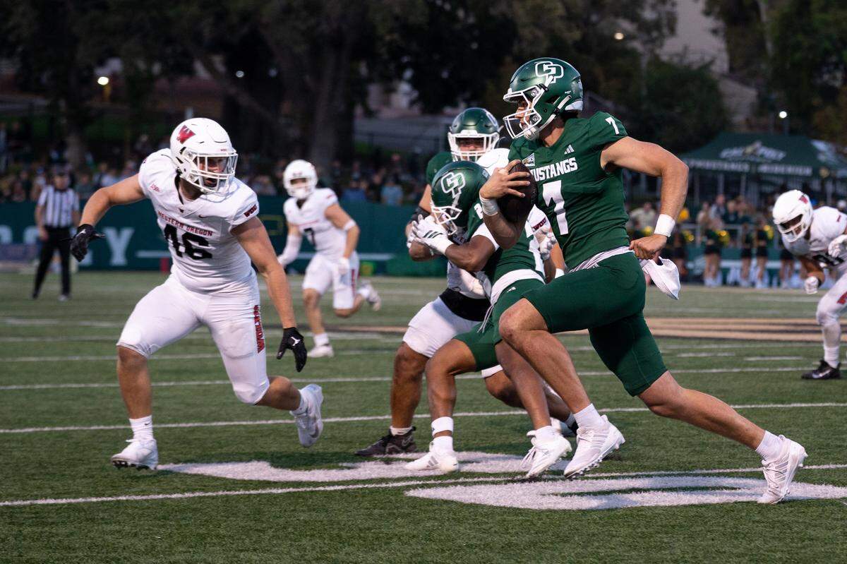 Cal Poly quarterback Ty Dieffenbach scrambles for more yardage in the third quarter against Western Oregon on Saturday, Sept. 13, 2025. The Mustangs defeated the Wolves in a 56-7 rout at home.