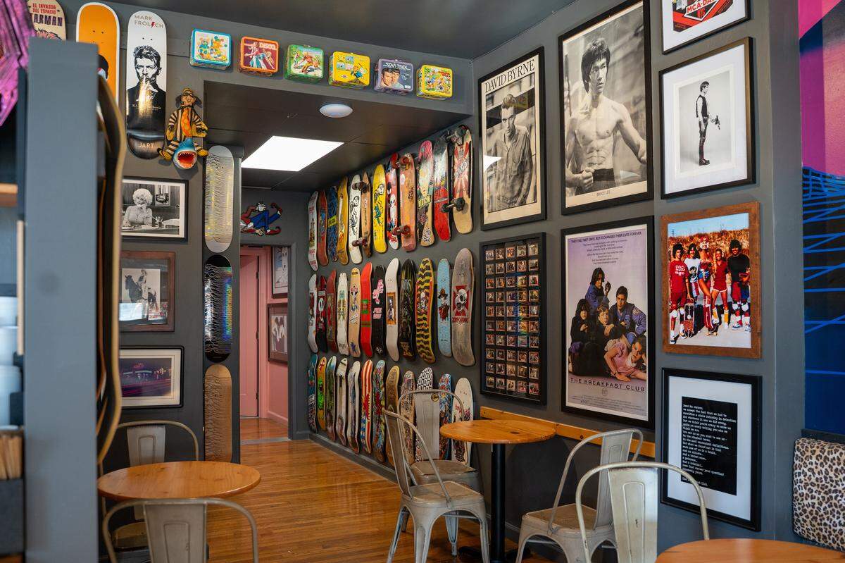 Skateboards and pop culture memorabilia decorate the interior of the new Nautical Bean in Morro Bay on Wednesday, Sept. 3, 2025. Nautical Bean's fifth location in San Luis Obispo County opened in Morro Bay at 911 Main Street on Labor Day weekend.