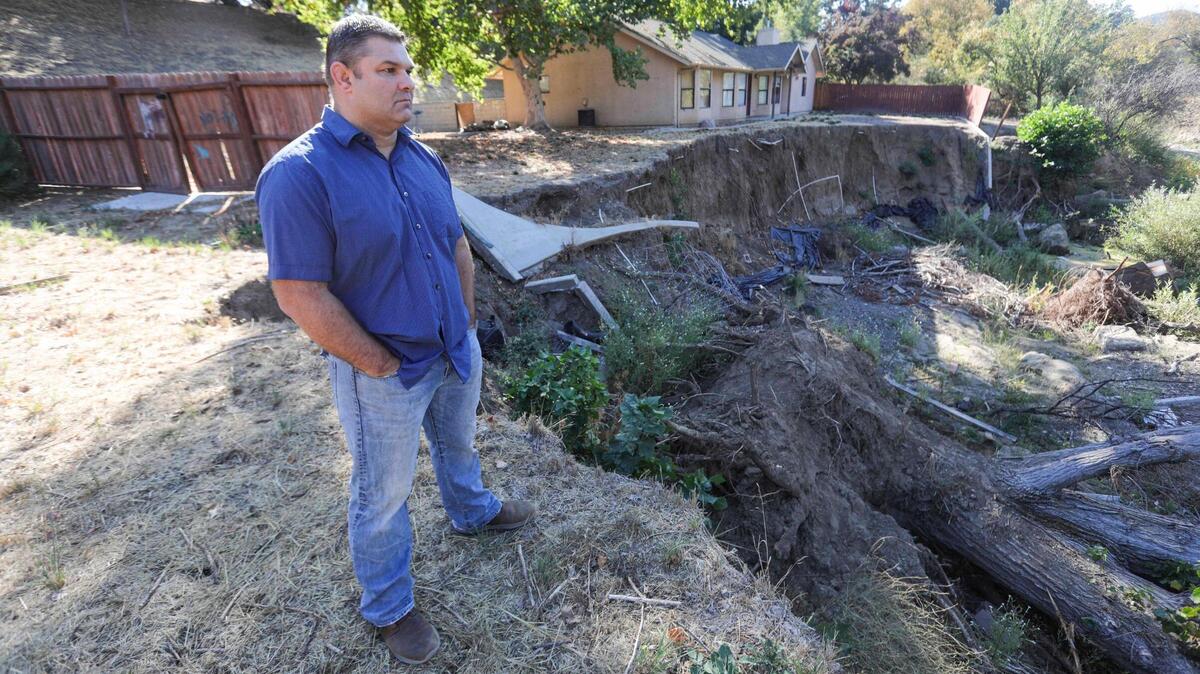 Aaron Spiller lost most of his Atascadero backyard and his house was red-tagged as uninhabitable by the city of Atascadero after storm debris rerouted the flow of Graves Creek into his yard during the March 2023 storms. Pictured here on Oct. 18, 2023. 