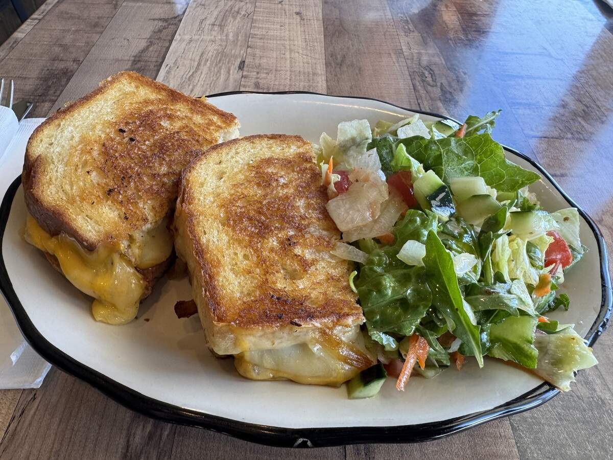 An adult grilled cheese with American and cheddar cheese, caramelized onions and bacon from The Porch Cafe and Bar in Santa Margarita on June 29, 2026.