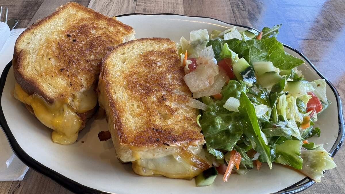An adult grilled cheese with American and cheddar cheese, caramelized onions and bacon from The Porch Cafe and Bar in Santa Margarita on June 29, 2026.