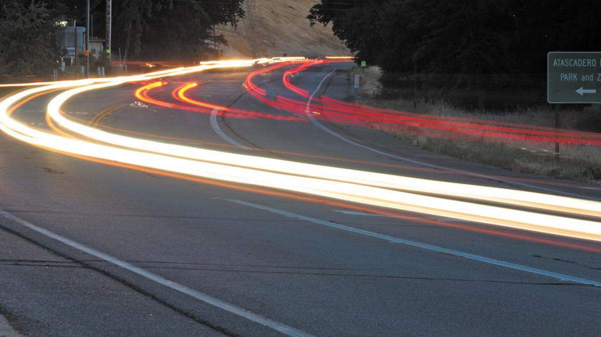 Traffic flows at dusk on Highway 41 in Atascadero in this 30-second exposure looking west near Atascadero Lake Park and the Charles Paddock Zoo.