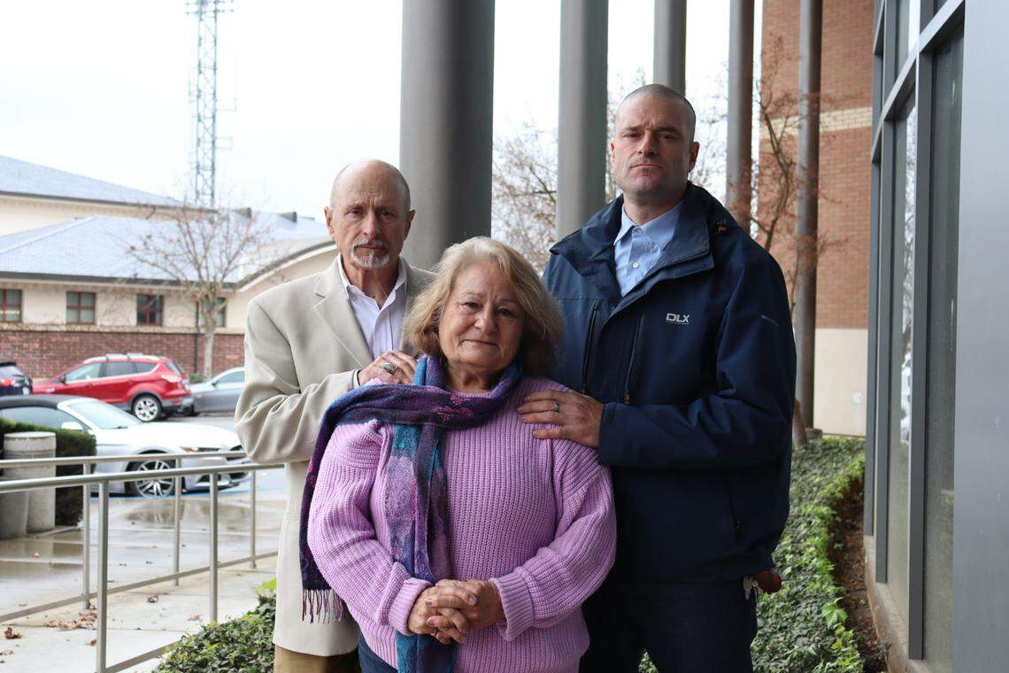 Michael Hendry, left, his wife, Anita, and their son, Conar, outside the Paso Robles courthouse on Feb. 17, 2026. Michael and Anita sued stuntman Jonathan Spano after their daughter, Tanya Hendry, died in an ATV crash at a “Burning Man” style party he hosted in 2020.