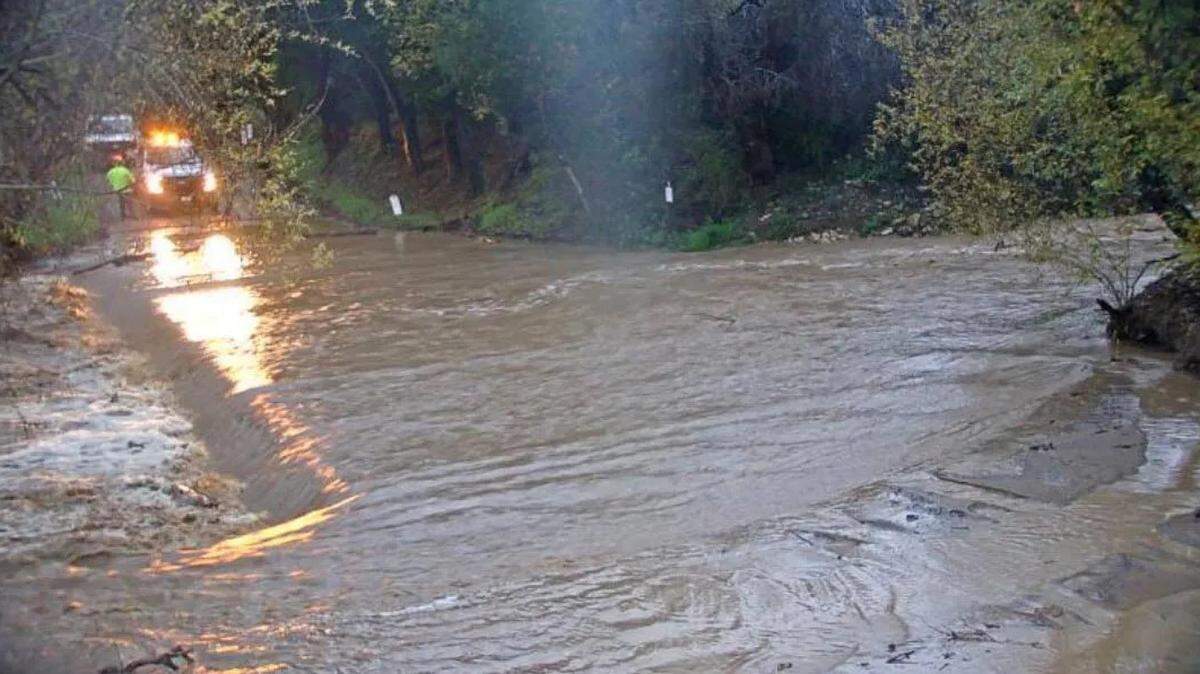 Refugio Road, in the Alisal Fire burn scar, is seen around 7 a.m. Thursday, Jan. 5, 2023, after the rainstorm caused mud to flow over the roadway.