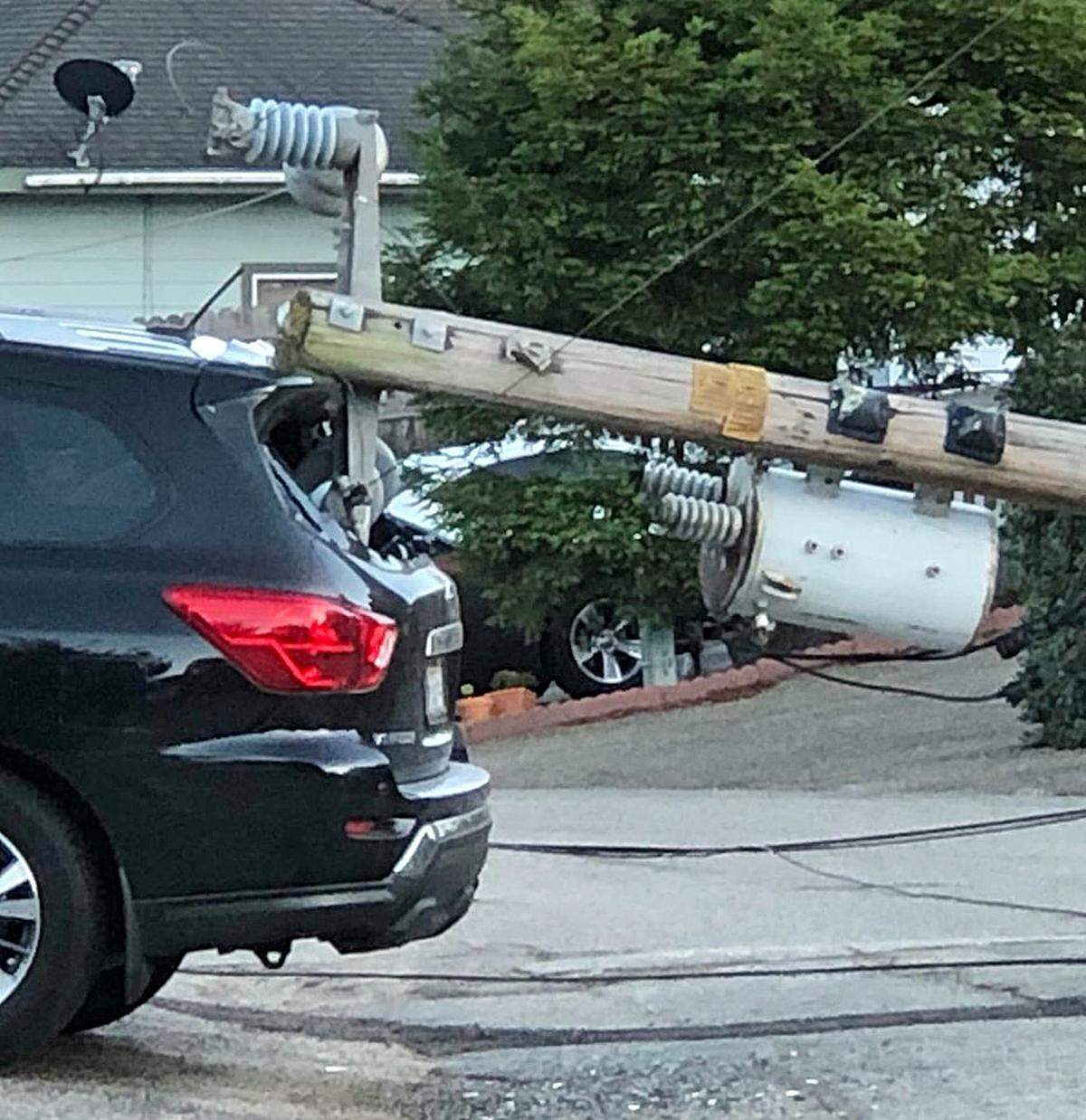 A utility poll in Cambria gave way and crashed into an SUV parked nearby Tuesday, Oct. 1.