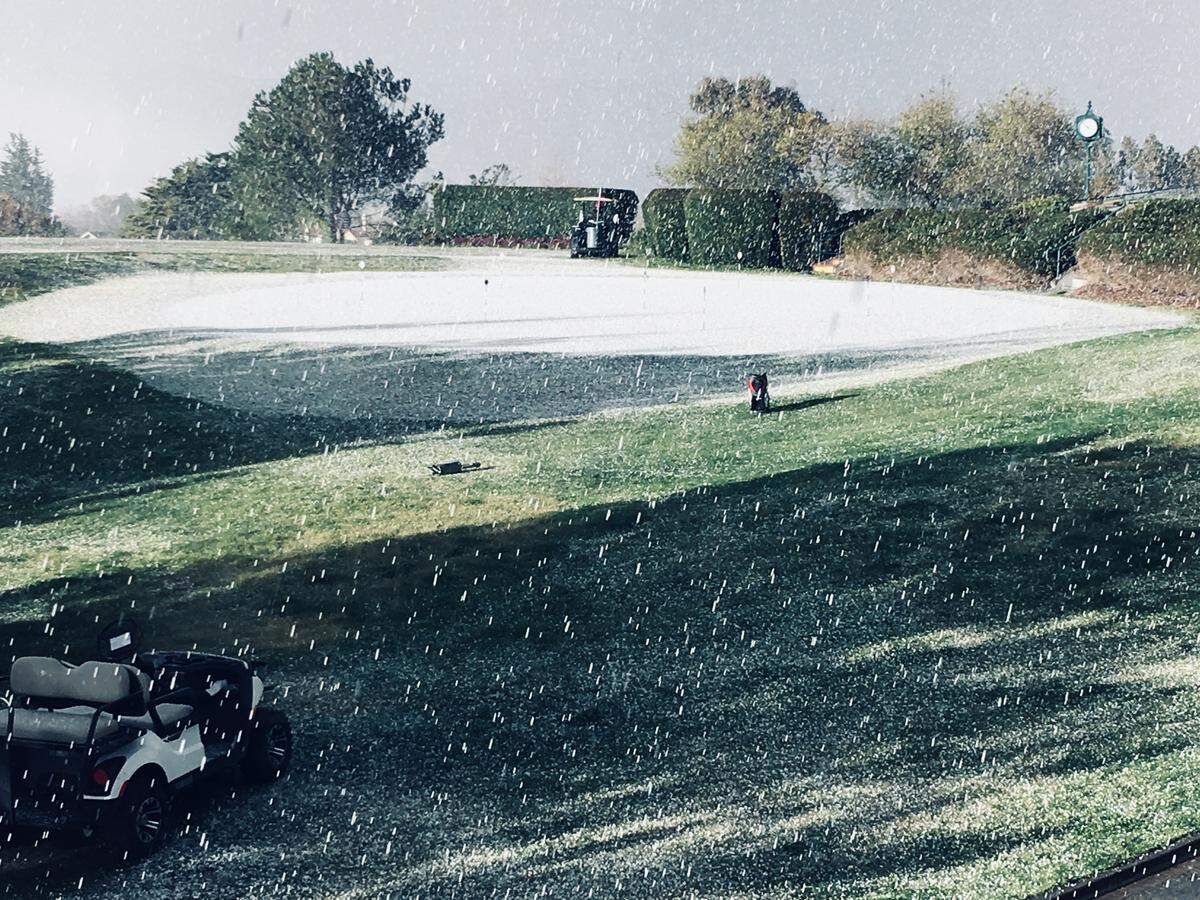 Hail blocks out the view at the 9th hole of San Luis Obispo Country Club.