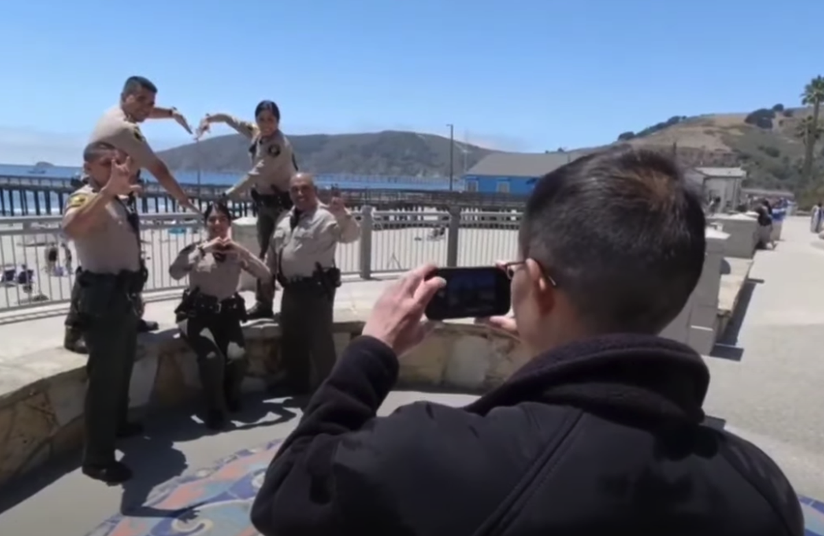 Deputies strike a pose in a final scene in the video shot in Avila Beach. The video was yanked from the department’s Facebook page following numerous complaints.