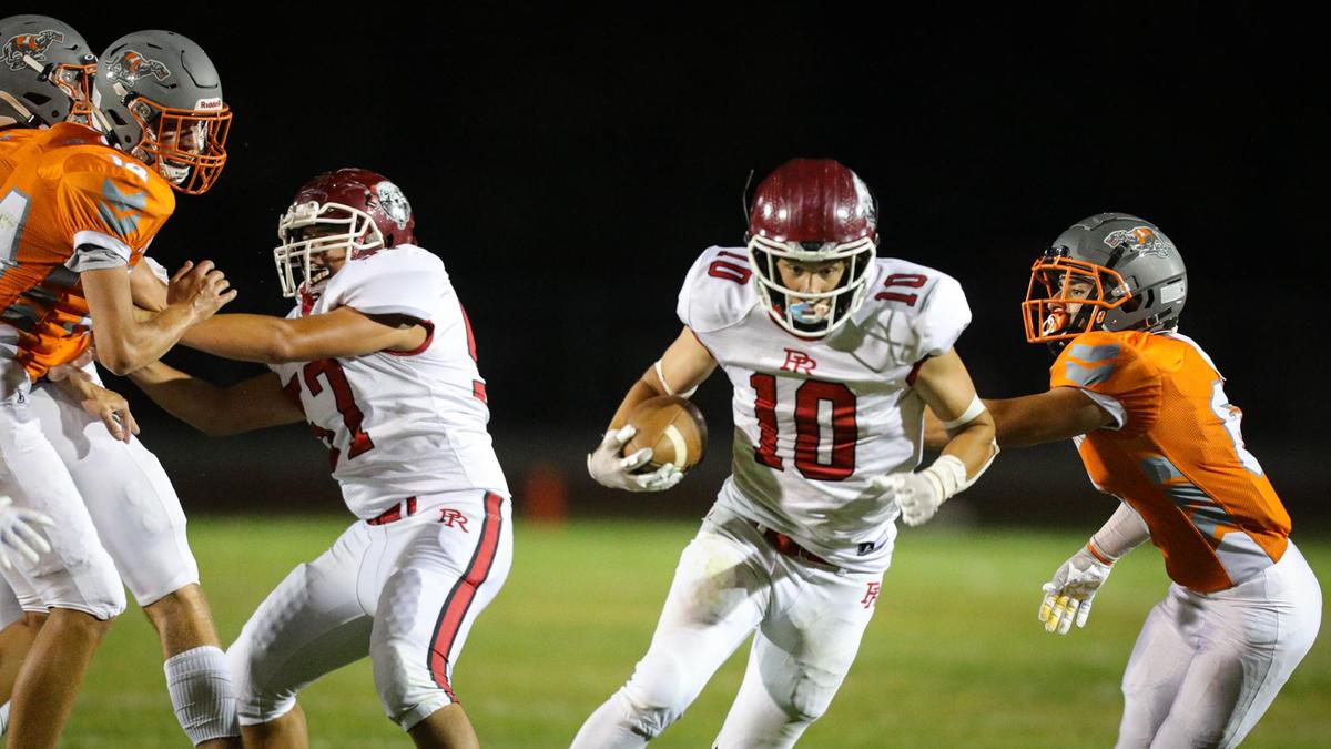 Connor Bowman runs for the Bearcats. In the annual rivalry game, Paso Robles beat Atascadero 35-21 on Sept. 2, 2022.