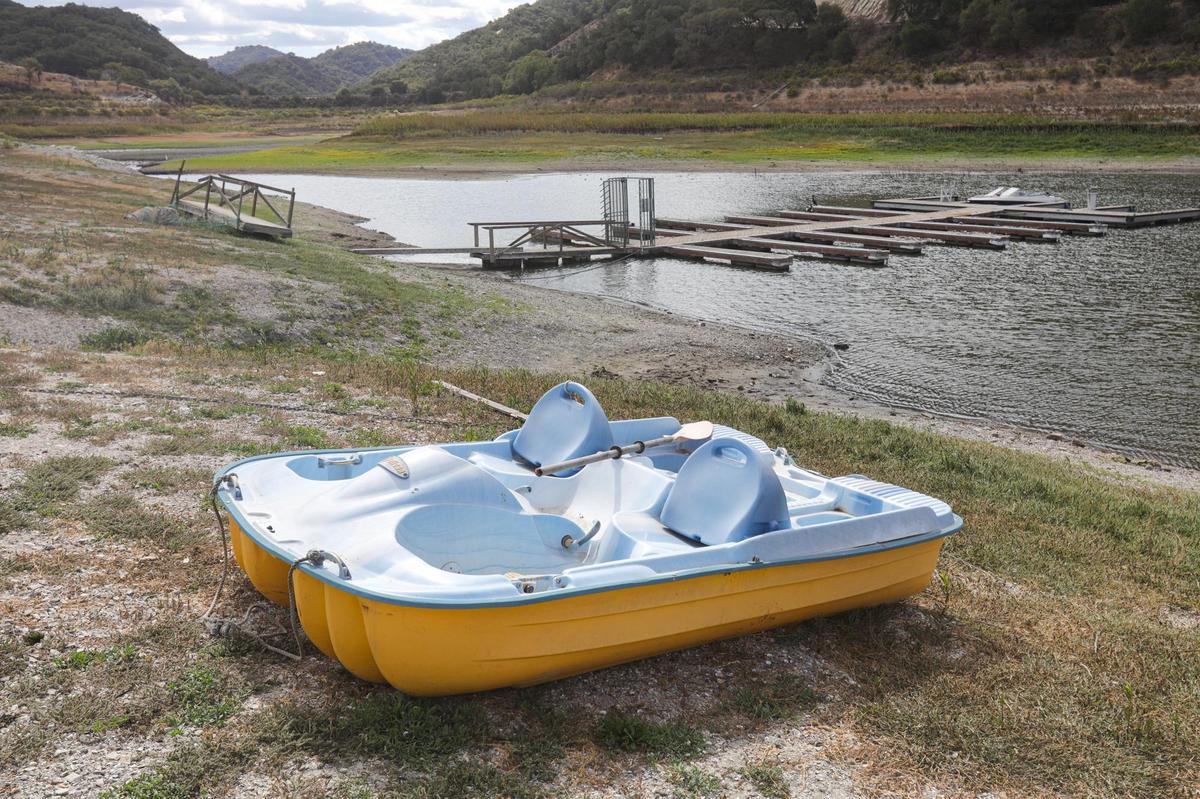 A paddle boat sits beach in a spot at Lopez Lake that is usually underwater. Lopez Lake, the primary water source for Arroyo Grande, Grover Beach, Oceano and Pismo Beach, was at 31% capacity at the beginning of October 2021.